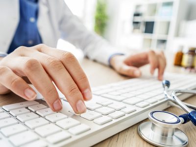 doctor using computer keyboard